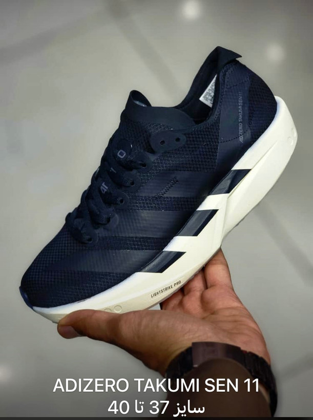 کتونی آدیداس آدیزیرو تاکومی سن 11 سایز 37 تا 40 مشکی سفید ADIDAS ADIZERO