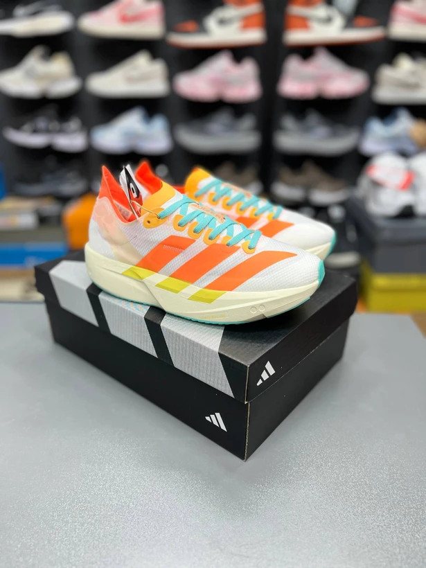 کتونی آدیداس آدیزیرو تاکومی سن 11 سایز 37 تا 40 سفید نارنجی زرد ADIDAS ADIZERO